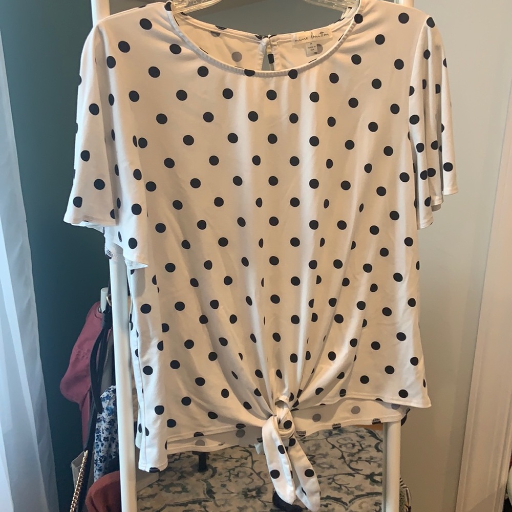 Black and white polka dot top.